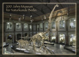 Mounted skeleton of Giraffatitan in dinosaur hall of Natural History Museum in Berlin on post card of Germany 2010