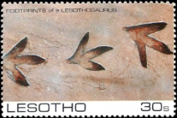 Dinosaur footprint on stamp